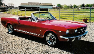 Picture red mustang convertible side view.